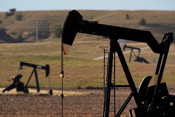 FILE - Pumpjacks operate in a pasture, Sept. 30, 2024, near Hays, Kan. (AP Photo/Charlie Riedel, File)