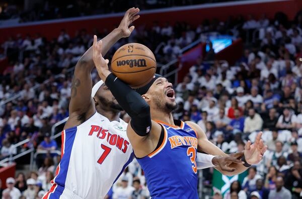New York Knicks guard Josh Hart (3) loses the ball while defended by Detroit Pistons forward Paul Reed (7) during the first half of Game 6 of an NBA basketball first-round playoff series Thursday, May 1, 2025, in Detroit. (AP Photo/Duane Burleson)