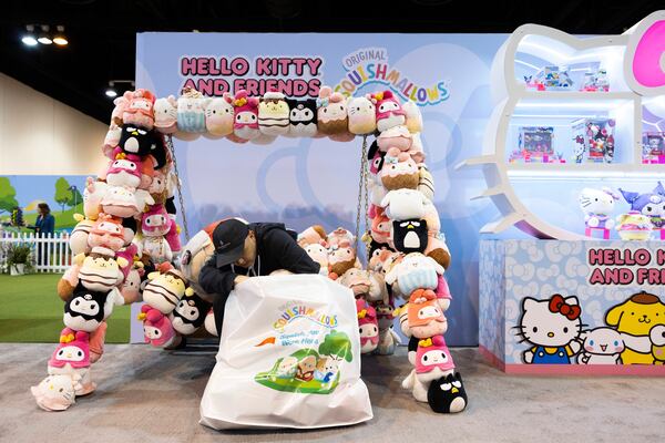 Kevin Gao of San Francisco sorts through his bag of Squishmallows from the Jazwares booth in CHI Health Center Omaha for the Berkshire Hathaway annual meeting Saturday, May 3, 2025, in Omaha, Neb. (AP Photo/Rebecca S. Gratz)