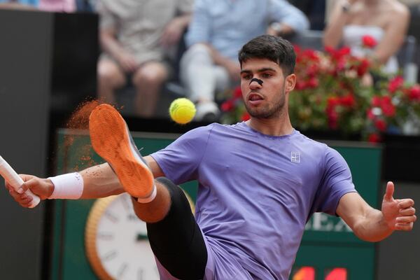 Spain's Carlos Alcaraz in action against Serbia's Dusan Lajovic during the Italian Open tennis tournament in Rome, Friday May 9, 2025. (Alfredo Falcone/LaPresse via AP)