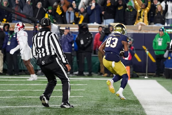 Notre Dame wide receiver Jayden Thomas (83) catches a five-yard touchdown reception against Indiana during the first half in the first round of the NCAA College Football Playoff, Friday, Dec. 20, 2024, in South Bend, Ind. (AP Photo/Darron Cummings)