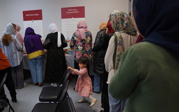 A group of female Afghan refugees gather for a class on self-care and a post-Ramadan celebration at Catholic Charities Migrant and Refugee Services office in Fredericksburg, Va., on Tuesday, April 8, 2025. (AP Photo/Jessie Wardarski)