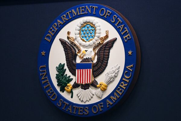 FILE - The State Department seal is seen on the briefing room lectern at the State Department in Washington, Jan. 31, 2022.(Mandel Ngan, Pool via AP, File)