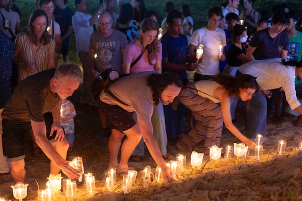 Relatives of victims of the 2004 Indian Ocean tsunami hold a candle light vigil as they participate in the 20th anniversary, at Tsunami Memorial Park at Ban Nam Khem, Takuapa district of Phang Nga province, southern Thailand, Thursday, Dec. 26, 2024. (AP Photo/Wason Wanichakorn)