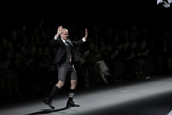 Designer Thom Browne accepts applause after the Thom Browne Fall/Winter 2025 fashion show as part of New York Fashion Week on Tuesday, Feb. 11, 2025, at The Shed in New York. (Photo by Evan Agostini/Invision/AP)