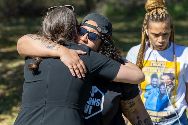 Lauren Sapp, center, deputy director of The Promise of Justice Initiative, hugs faith leaders and supporters of Jessie Hoffman Jr., who was convicted of a 1996 murder of Mary “Molly” Elliott, outside Louisiana State Penitentiary in Angola, La., for Hoffman's planned execution Tuesday, March 18, 2025. (Chris Granger/The Times-Picayune/The New Orleans Advocate via AP)