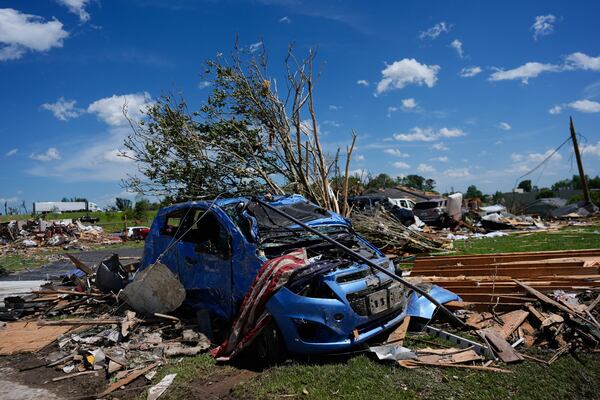 A vehicle is covered in debris after a severe storm passed the area on Saturday, May 17, 2025,in London, Ky. (AP Photo/Carolyn Kaster)