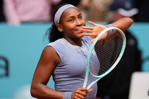 United States' Coco Gauff celebrates after her victory over Mirra Andreeva of Russia at the Madrid Open quarter-final tennis match in Madrid, Spain, Wednesday, April 30, 2025. (AP Photo/Manu Fernandez)