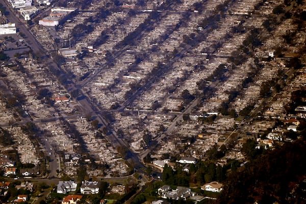 Homes are seen burned while a few still stand, Thursday, Jan. 9, 2025, in the Pacific Palisades section of Los Angeles. (AP Photo/Mark J. Terrill)