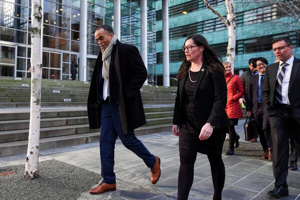 Washington Attorney General Nick Brown departs a press availability after a federal judge temporarily blocked President Donald Trump's executive order aimed at ending birthright citizenship in a case brought by the states of Washington, Arizona, Illinois and Oregon, Thursday, Jan. 23, 2025, in Seattle. (AP Photo/Lindsey Wasson)