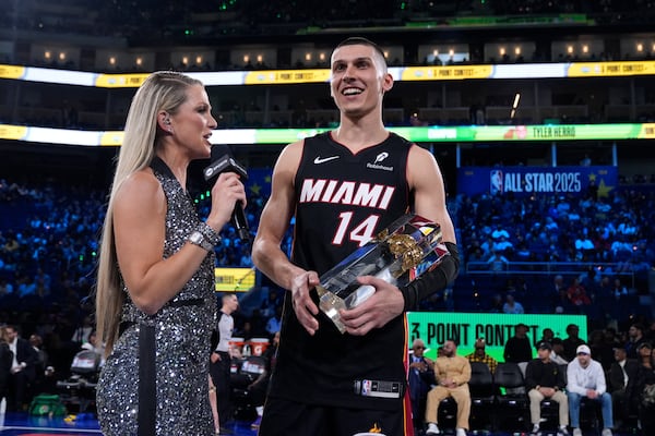 Miami Heat guard Tyler Herro is interviewed by Allie LaForce after winning the 3-point contest at the NBA basketball All-Star Saturday night festivities Saturday, Feb. 15, 2025, in San Francisco. (AP Photo/Godofredo A. Vásquez)