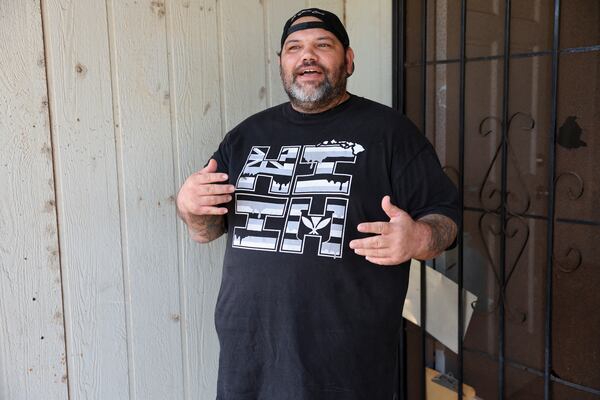 Joshua Kamalo, 43, speaks at his home about his election ordeal after his mail-in ballot was rejected by Maui County stating they couldn't verify his signature, Wednesday, Dec. 18, 2024, in Kahului, Hawaii. (AP Photo/Marco Garcia)