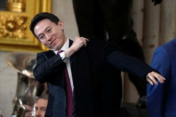 China's Vice President Han Zheng puts on his coat after the 60th Presidential Inauguration in the Rotunda of the U.S. Capitol in Washington, Monday, Jan. 20, 2025. (AP Photo/Julia Demaree Nikhinson, Pool)