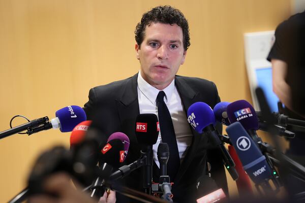 French actor Gerard Depardieu's lawyer Jeremie Assous speaks with the media after a verdict was delivered on accusations that the actor sexually assaulted two women who were working on a film with him in 2021, in Paris, Tuesday, May 13, 2025. (AP Photo/Thomas Padilla)