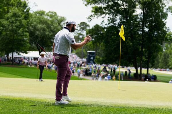 Jon Rahm, of Spain, waves after making a putt on the third hole during the third round of the PGA Championship golf tournament at the Quail Hollow Club, Saturday, May 17, 2025, in Charlotte, N.C. (AP Photo/George Walker IV)