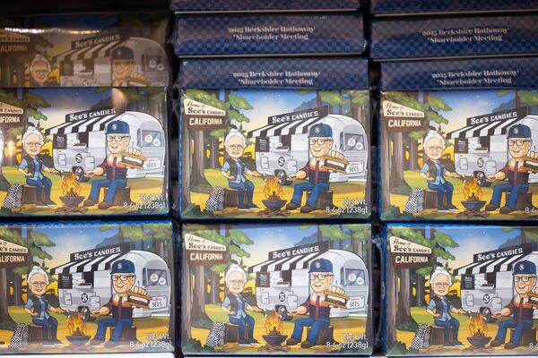 Boxes of See's Candies featuring an image of Warren Buffett at a campsite with See's Candies' namesake Mrs. See in CHI Health Center Omaha for the Berkshire Hathaway annual meeting Saturday, May 3, 2025, in Omaha, Neb. (AP Photo/Rebecca S. Gratz)