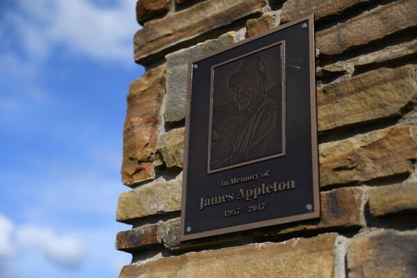 A plaque honoring water department employee James Appleton, who was fatally shot in 2017, hangs at the entrance of Gateway City Park in Gateway, Ark. on May 28, 2026. (AP Photo/Nick Ingram)