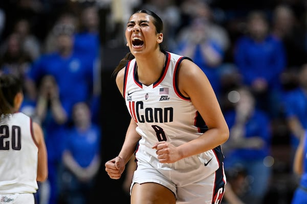 UConn center Jana El Alfy (8) reacts after making a basket during the first half of an NCAA college basketball game against Creighton in the finals of the Big East Conference tournament, Monday, March 10, 2025, in Uncasville, Conn. (AP Photo/Jessica Hill)