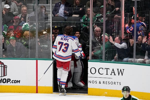 New York Rangers center Matt Rempe (73) leaves the game after being ejected for game misconduct in the third period of an NHL hockey game against the Dallas Stars in Dallas, Friday, Dec. 20, 2024. (AP Photo/Tony Gutierrez)