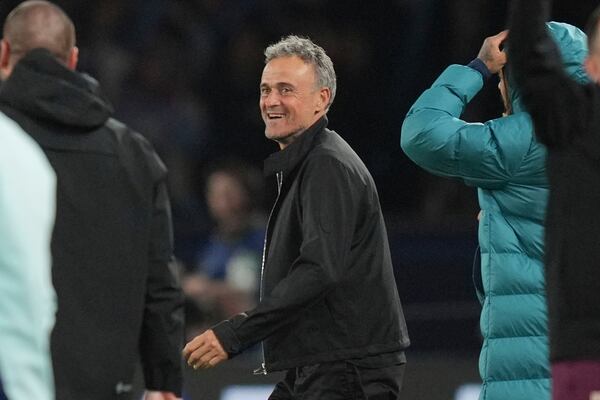 PSG's head coach Luis Enrique celebrates after the Champions League semifinal, second leg soccer match between Paris Saint-Germain and Arsenal at the Parc des Princes in Paris, Wednesday, May 7, 2025. (AP Photo/Thibault Camus)