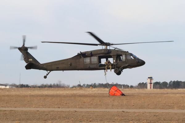 U.S. Army soldiers use Blackhawk helicopters to assist the South Carolina Forestry Commission and the South Carolina Department of Natural Resources with wildfire containment in Horry County, S.C., Sunday, March 2, 2025. (Elizabeth A. Schneider/U.S. Army via AP)