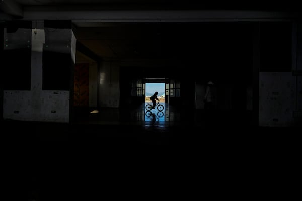 A Meitei boy rides on a bicycle in a relief camp in Imphal, Manipur, Monday, Dec. 16, 2024. (AP Photo/Anupam Nath)