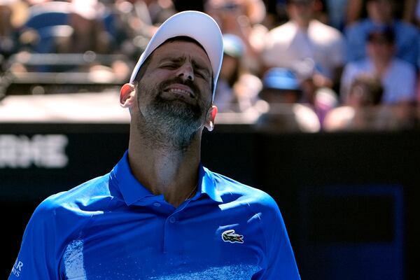 Novak Djokovic of Serbia reacts during his semifinal match against Alexander Zverev of Germany at the Australian Open tennis championship in Melbourne, Australia, Friday, Jan. 24, 2025. (AP Photo/Asanka Brendon Ratnayake)