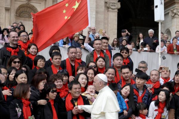 FILE - Pope Francis meets a group of faithful from China at the end of his weekly general audience in St. Peter's Square at the Vatican on April 18, 2018. (AP Photo/Gregorio Borgia, File)