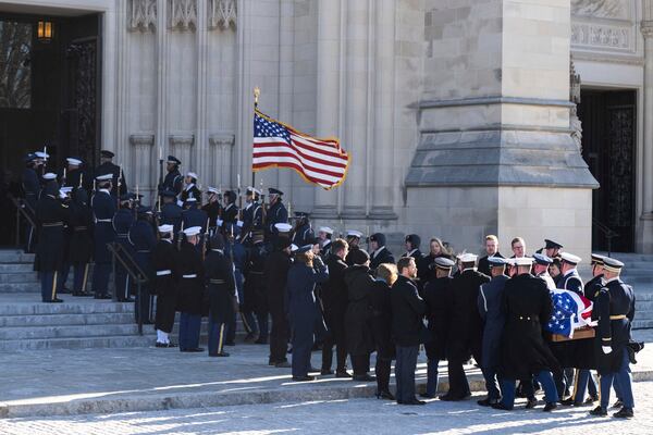 The flag-draped casket of former President Jimmy Carter arrives at the National Cathedral for a state funeral, Thursday, Jan. 9, 2025, in Washington. (Saul Loeb/Pool via AP)