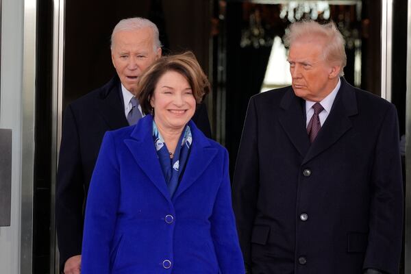 President Joe Biden and President-elect Donald Trump, escorted by Sen. Amy Klobuchar, D-Minn., walk out to the presidential limousine, as they depart the White House, Monday, Jan. 20, 2025, in Washington, enroute to the Capitol. (AP Photo/Alex Brandon)