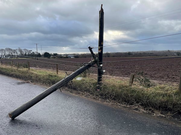 A broken telegraph pole on Blaris Road, Co Antrim, Ireland, as Storm Eowyn hits the country, Friday Jan. 24, 2025. (Jonathan McCambridge/PA via AP)