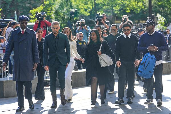 Family and supporters of Sean "Diddy" Combs, including his sons Quincy Brown, third from left, and Justin Combs, second from right, arrive to the courthouse in New York, Monday, May 12, 2025. (AP Photo/Seth Wenig)