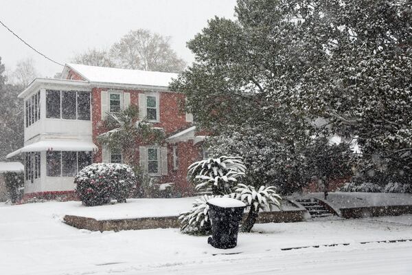 Homes covered in snow in a neighborhood where up to six inches have accumulated on Tuesday, Jan. 21, 2025, in Pensacola, Fla. (Luis Santana/Tampa Bay Times via AP)