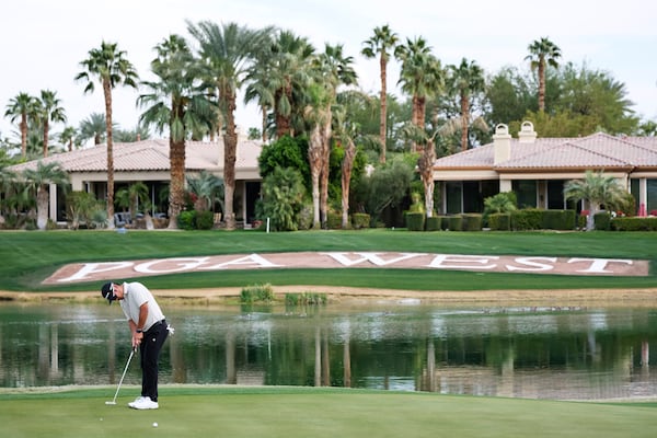 Ryo Hisatsune putts on the 18th green at the Nicklaus Tournament Course during the first round of the American Express golf tournament in La Quinta, Calif., Thursday, Jan. 16, 2025. (AP Photo/William Liang)