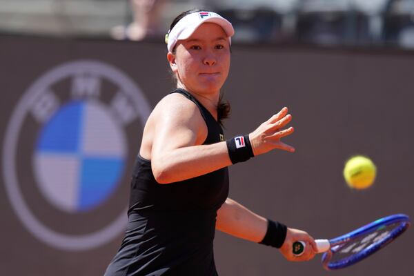 New Zealand's Lulu Sun plays a return to Italy's Jasmine Paolini during the 3rd round at the WTA Master 1000 Internazionali d'Italia tournament at Foro Italico in Rome, Italy, Thursday May 8, 2025 (Alfredo Falcone/LaPresse via AP)