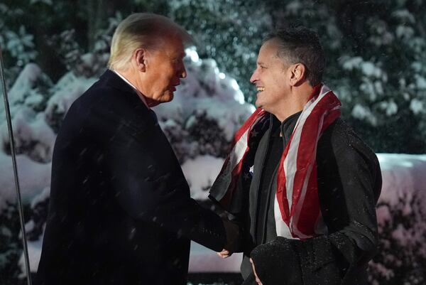 President Donald Trump greets Marc Fogel at on the South Lawn at the White House, Tuesday, Feb. 11, 2025, in Washington. (AP Photo/Evan Vucci)