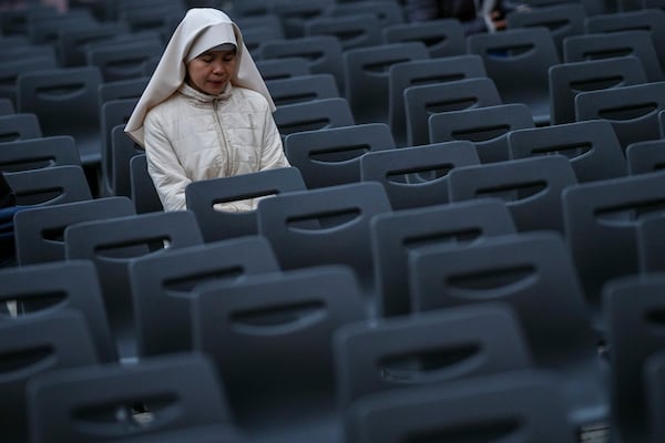 A nun attends a Rosary prayer for Pope Francis, in St. Peter's Square at the Vatican, Monday, March 10, 2025. (AP Photo/Andrew Medichini)