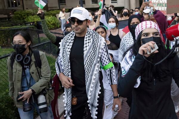 FILE - Mohsen Mahdawi, center, looks on during a pro-Palestinian protest at Columbia University, Thursday, Oct. 12, 2023, in New York. (AP Photo/Yuki Iwamura, File)
