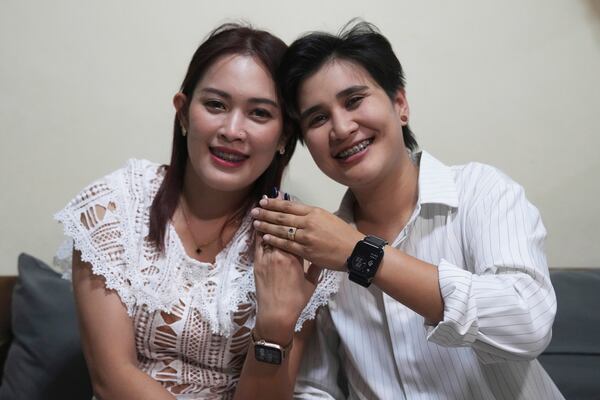 Sunma Piamboon, left, and her partner Danaya Phonphayung show their wedding ring in Bangkok, Thailand, on Jan. 13, 2025. (AP Photo/Sakchai Lalit)