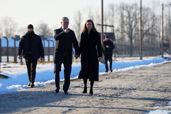 Britain's Prime Minister Keir Starmer and his wife Victoria Starmer visit the Memorial And Museum Auschwitz-Birkenau, a former Nazi German concentration and extermination camp, in Oswiecim, Poland, Friday Jan. 17, 2025. (Aleksandra Szmigiel/Pool via AP)