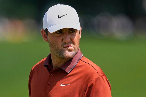 Scottie Scheffler reacts after the 16th hole during the first round of the PGA Championship golf tournament at the Quail Hollow Club, Thursday, May 15, 2025, in Charlotte, N.C. (AP Photo/David J. Phillip)