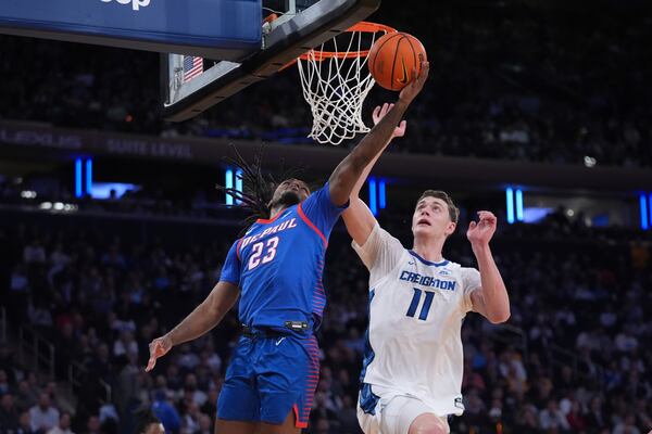 DePaul's David Thomas (23) drives past Creighton's Ryan Kalkbrenner (11) during the second half of an NCAA college basketball game at the Big East basketball tournament Thursday, March 13, 2025, in New York. (AP Photo/Frank Franklin II)