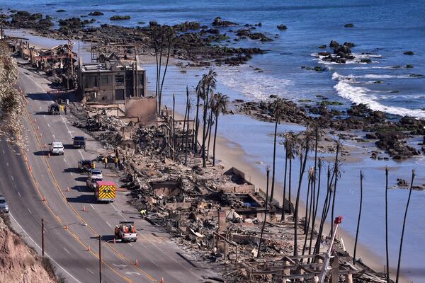 Homes along Pacific Coast Highway are seen burn out from the Palisades Fire, Sunday, Jan. 12, 2025, in Malibu, Calif. (AP Photo/Mark J. Terrill)