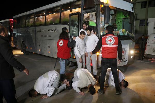 Freed Palestinian prisoners react as they arrive in the Gaza Strip after being released from an Israeli prison following a ceasefire agreement between Hamas and Israel in Khan Younis, Gaza Strip, Thursday, Feb. 27, 2025. (AP Photo/Jehad Alshrafi)