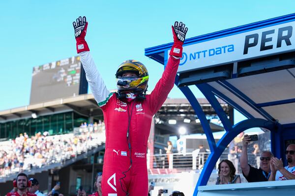 Robert Shwartzman, of Israel, celebrates after winning the pole position during qualifications for the Indianapolis 500 auto race at Indianapolis Motor Speedway in Indianapolis, Sunday, May 18, 2025. (AP Photo/Michael Conroy)