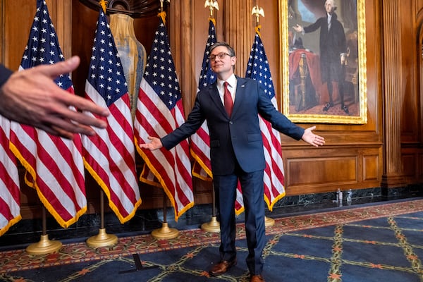 House Speaker Mike Johnson, R-La., greets families of members during a ceremonial swearing-in in the Rayburn Room at the Capitol in Washington, Friday, Jan. 3, 2025. (AP Photo/Jacquelyn Martin)