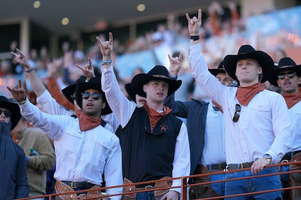 Texas fans cheer during the first half of a first round game against Clemson in the College Football Playoff, Saturday, Dec. 21, 2024, in Austin, Texas. (AP Photo/Eric Gay)