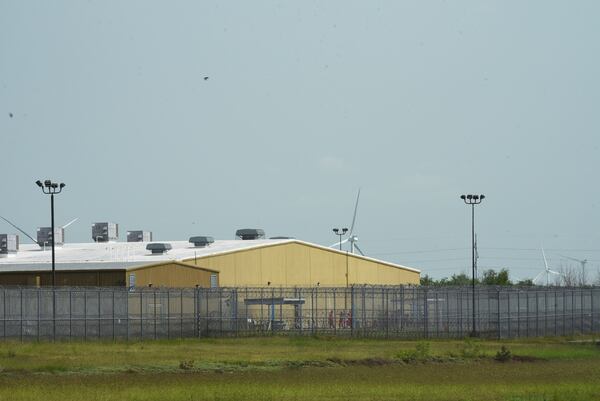 Detainees held at El Valle Detention Center in Raymondville, Texas are seen outside briefly, Thursday, May 1, 2025, after a federal judge in the district barred the Trump administration from deporting any Venezuelans from South Texas under the Alien Enemies Act, an 18th-century wartime law. (AP Photo/Valerie Gonzalez)