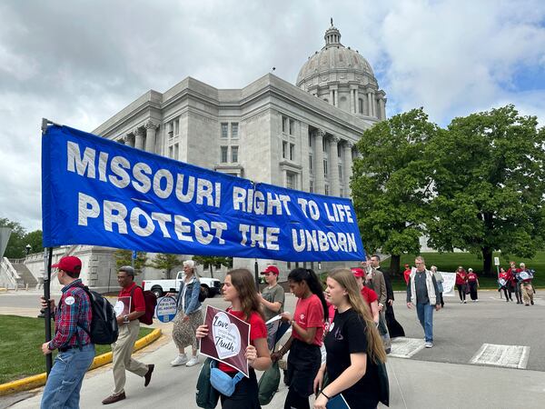 Participants in the Midwest March for Life walk past the Missouri Capitol on May 1, 2025, in Jefferson City, Mo. (AP Photo/David A. Lieb)