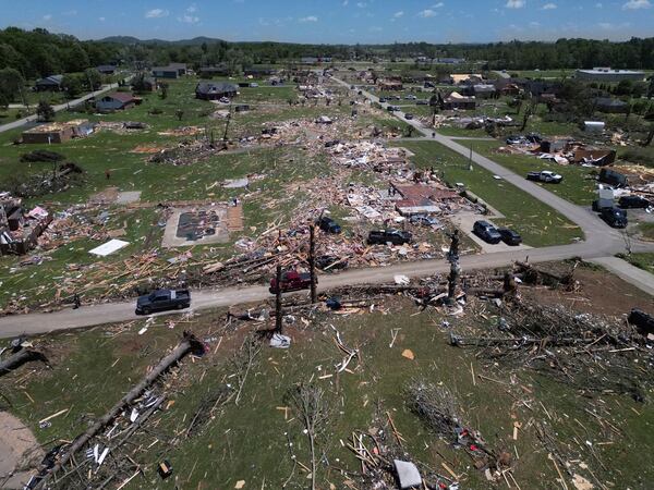 A home is destroyed after a severe storm passed through the area Saturday, May 17, 2025, in London, Ky (AP Photo/Carolyn Kaster)